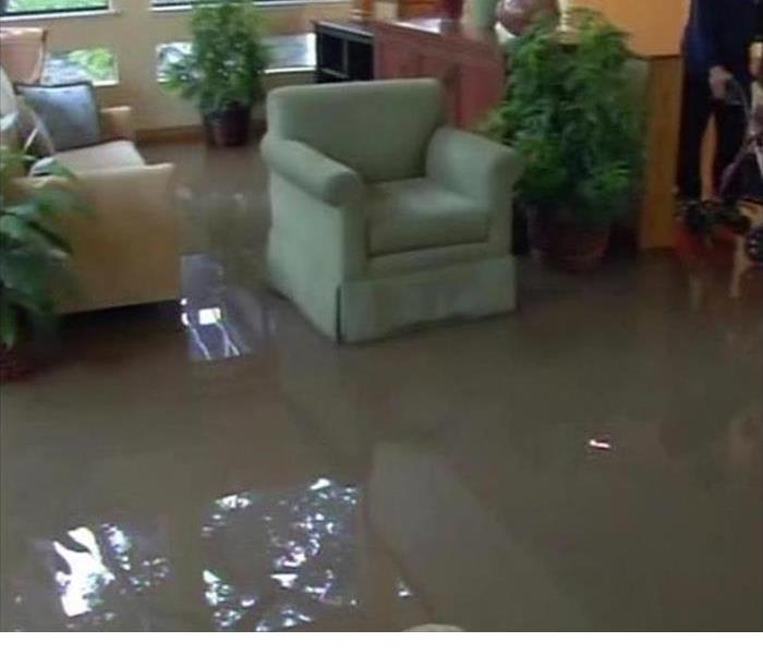 Living room flooded with water.