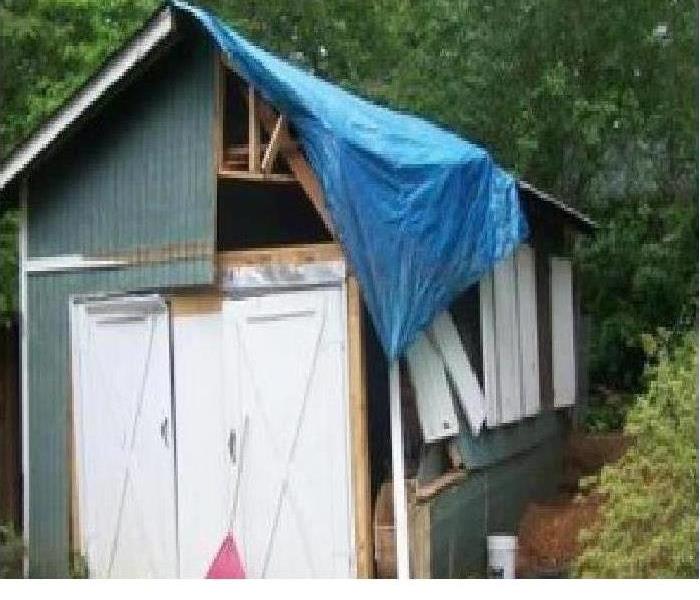Shed that has been damaged.