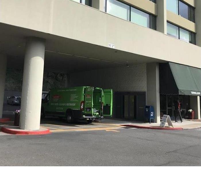 SERVPRO truck in front of high rise