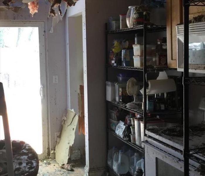 kitchen burned by fire, soot everywhere